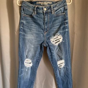 High waisted distressed jeans